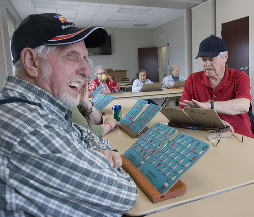 Al Hartmann   |  The Salt Lake Tribune 
Bill Gilman, left, enjoys a good game of bingo at the North Davis Senior Activity Center in Clearfield. The new center is west of the Clearfield City Center.