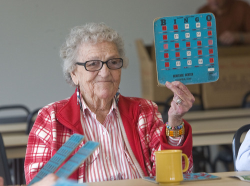 Al Hartmann   |  The Salt Lake Tribune 
Bobby Wixom raises her card as she wins a bingo game at the North Davis Senior Activity Center in Clearfield. The new facility replaces the old Heritage Senior Activity Center, which shut down at the end of February for the move.