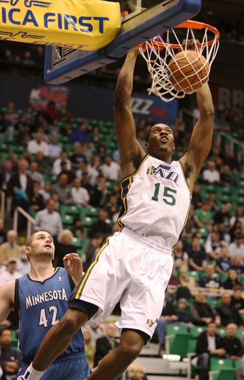 Steve Griffin  |  The Salt Lake Tribune
 
Utah Jazz forward Derrick Favors slams the ball after driving around Minnesota's Kevin Love during a game against the Timberwolves at EnergySolutions Arena  in Salt Lake City on Wednesday, March 16, 2011.