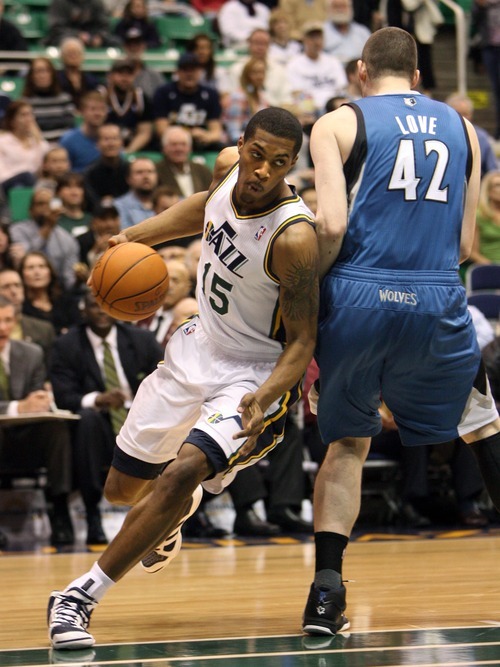 Steve Griffin  |  The Salt Lake Tribune
 
Utah Jazz forward Derrick Favors drives around Minnesota's Kevin Love during a game against the Timberwolves at EnergySolutions Arena  in Salt Lake City on Wednesday, March 16, 2011.
