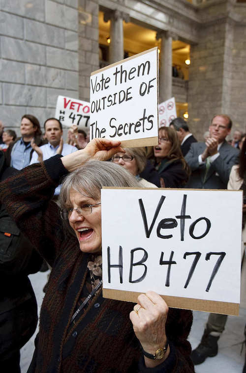 File photo  |  The Salt Lake Tribune
Rep. Kraig Powell, R-Heber City, is shown, right, behind sign, at this March 8 Capitol rally against HB477. Powell is apologizing for his votes for HB477, changing Utah's open-records law. He now calls the legislation an 