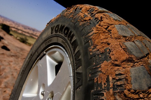 Djamila Grossman  |  The Salt Lake Tribune

A Jeep tire is caked with red mud after driving on the Gemini Bridges trail near Moab on Saturday, Oct. 2, 2010.
