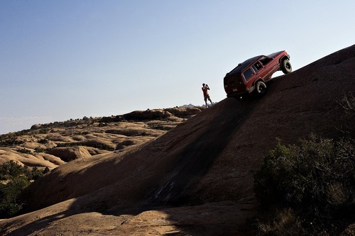 Djamila Grossman  |  The Salt Lake Tribune
A Jeep makes it up a hill on the Fins & Things 4x4 trail near Moab on Saturday, Oct. 2, 2010.