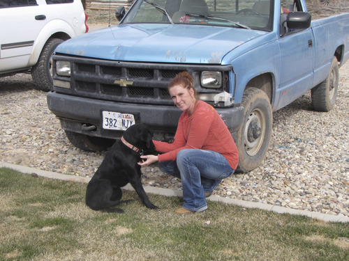 Parowan resident Amber Burton on Tuesday with her year-old black Labradour Sophie. She said she got the dog after the city's police chief last summer allegedly shot and killed another pet dog she had strong attachment to. Mark Havnes/The Salt Lake Tribune