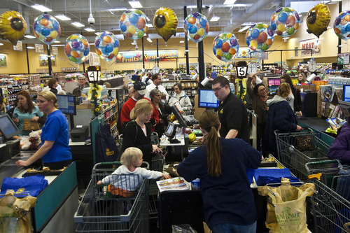 Chris Detrick | The Salt Lake Tribune 
Shoppers check out at Sunflower Farmers Market at 656 E. 200 South in Salt Lake City on Wednesday March 16, 2011.