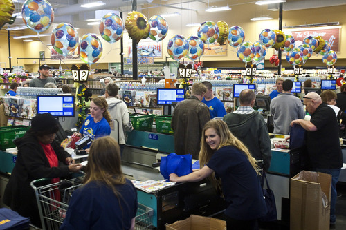 Chris Detrick | The Salt Lake Tribune 
Shoppers check out at Sunflower Farmers Market at 656 E. 200 South in Salt Lake City.