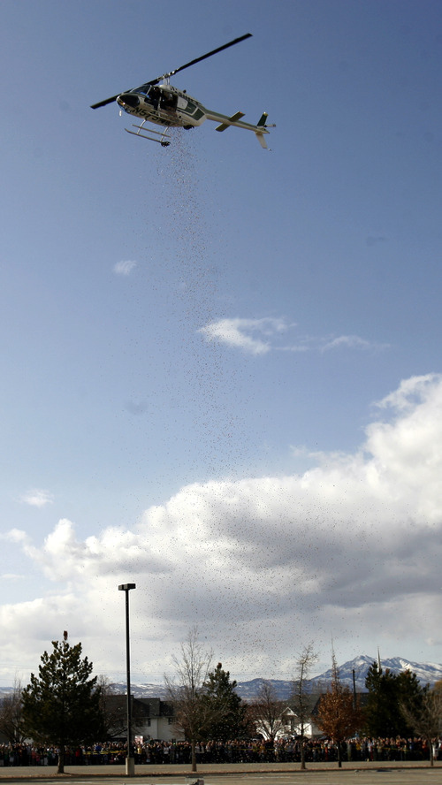 Rick Egan   |  The Salt Lake Tribune

A helicopter drops 20,000 bouncy balls into a parking lot on the Utah State Campus in Logan,  Monday, March 14, 2011. The BOuncy ball drop was parat of the Utah State University College of Science's 