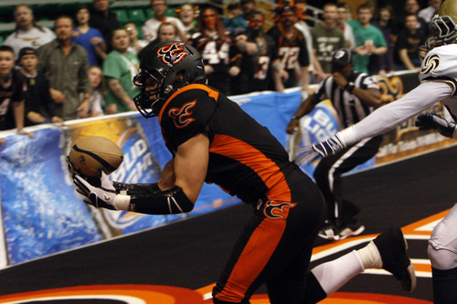 Photo by Chris Detrick | The Salt Lake Tribune 
Utah Blaze's Aaron Boone (1) scores a touchdown during the game at EnergySolutions Arena Thursday March 17, 2011.