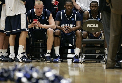 Djamila Grossman  |  The Salt Lake Tribune

Utah State University's Brady Jardine (22), Pooh Williams (5) and Brockeith Pane (3) look on during a timeout as their team falls behind against Kansas State during the second round of the NCAA tournament at the University of Arizona's McKale Center in Tucson, Ariz., on Thursday, March 17, 2011. USU lost the game.