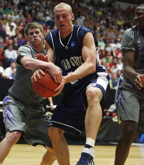 Djamila Grossman  |  The Salt Lake Tribune

Utah State University's Brady Jardine (22) and Kansas State's Will Spradling (55) fight over the ball during the first half of the second round of the NCAA tournament at the University of Arizona's McKale Center in Tucson, Ariz., on Thursday, March 17, 2011.