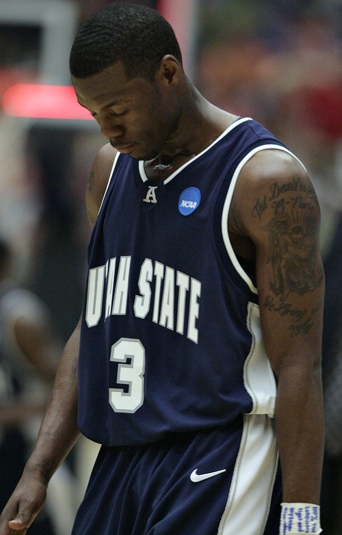 Djamila Grossman  |  The Salt Lake Tribune

Utah State University's Brockeith Pane (3) walks off the court after the first half of a game against Kansas State in the second round of the NCAA tournament at the University of Arizona's McKale Center in Tucson, Ariz., on Thursday, March 17, 2011.