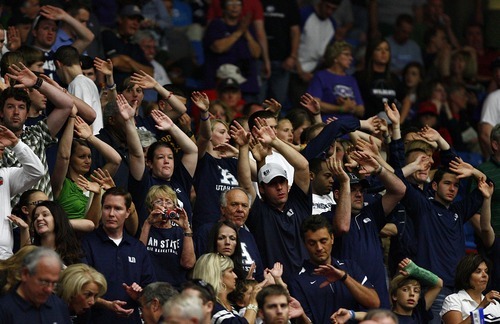 Djamila Grossman  |  The Salt Lake Tribune

Utah State University's fans get ready for the game against Kansas State's during the second round of the NCAA tournament at the University of Arizona's McKale Center in Tucson, Ariz., on Thursday, March 17, 2011.