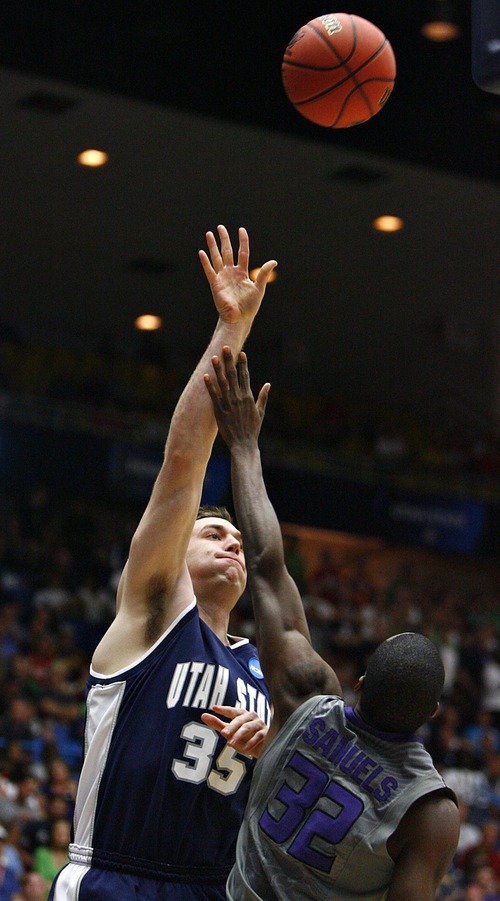 Djamila Grossman  |  The Salt Lake Tribune

Utah State University's Nate Bendall (35) gets blocked by Kansas State's Jamar Samuels (32) in the first half of the second round of the NCAA tournament at the University of Arizona's McKale Center in Tucson, Ariz., on Thursday, March 17, 2011.