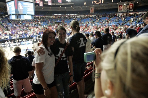 Djamila Grossman  |  The Salt Lake Tribune

Utah State University fans take pictures of each other before the second round of the NCAA tournament at the University of Arizona's McKale Center in Tucson, Ariz., on Thursday, March 17, 2011.