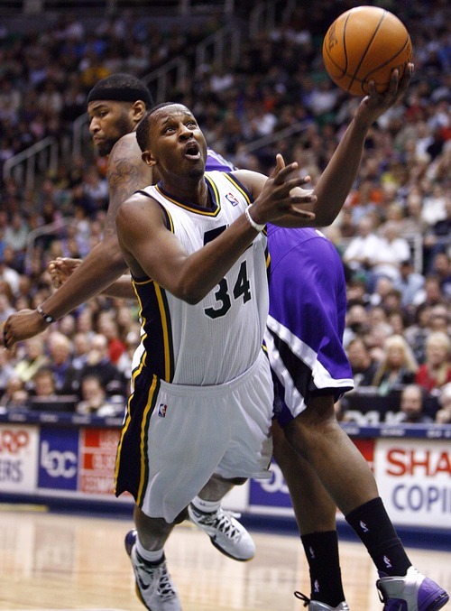 Djamila Grossman  |  The Salt Lake Tribune

The Utah Jazz' C.J. Miles (34) falls as he shoots the ball over the Sacramento Kings' DeMarcus Cousins (15), during a game at Energy Solutions Arena in Salt Lake City, Utah, on Saturday, March 5, 2011. The Jazz won the game.