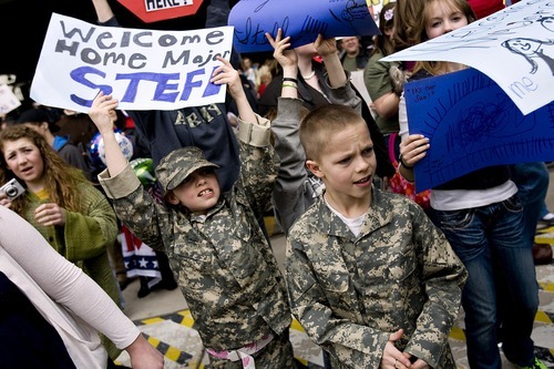 Sarah A. Miller  |  The Salt Lake Tribune

Katie Stefl, 8, and her brother TJ Stefl of Farmington cheer as their dad, Maj. David Stefl, returns Sunday with the Air National Guard's 144th Area Support Medical Company.