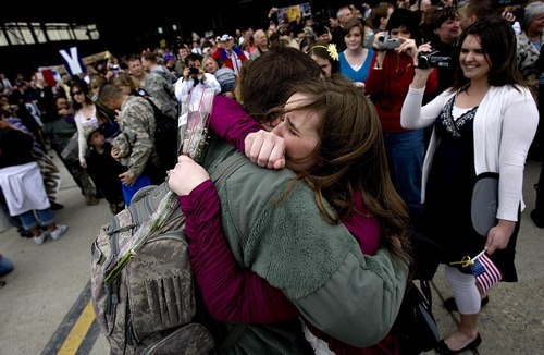 Sarah A. Miller  |  The Salt Lake Tribune

Elise Reneer of Sandy hugs her husband, Specialist Ryan Reneer, as he arrives Sunday, March 20, with other members of the Air National Guard's 144th Area Support Medical Company after a 12-month deployment to Afghanistan. They returned to the Air National Guard Base in Salt Lake City.
