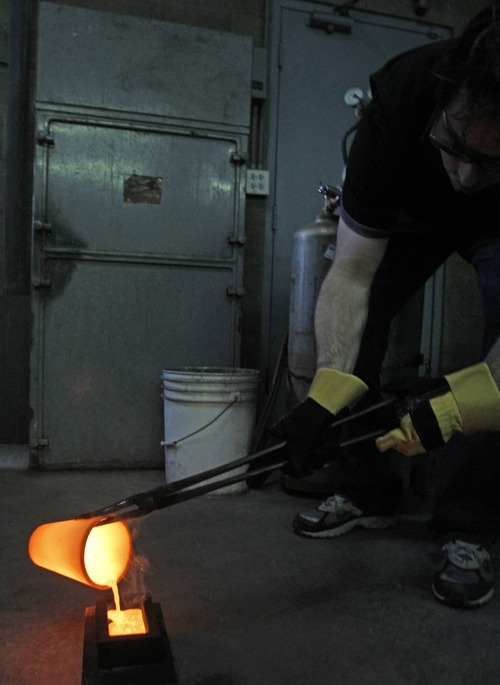 Rick Egan   |  The Salt Lake Tribune

Christ Wright, pours silver into ingots at
Cascade Refining in West Valley City, Monday, March 14, 2011