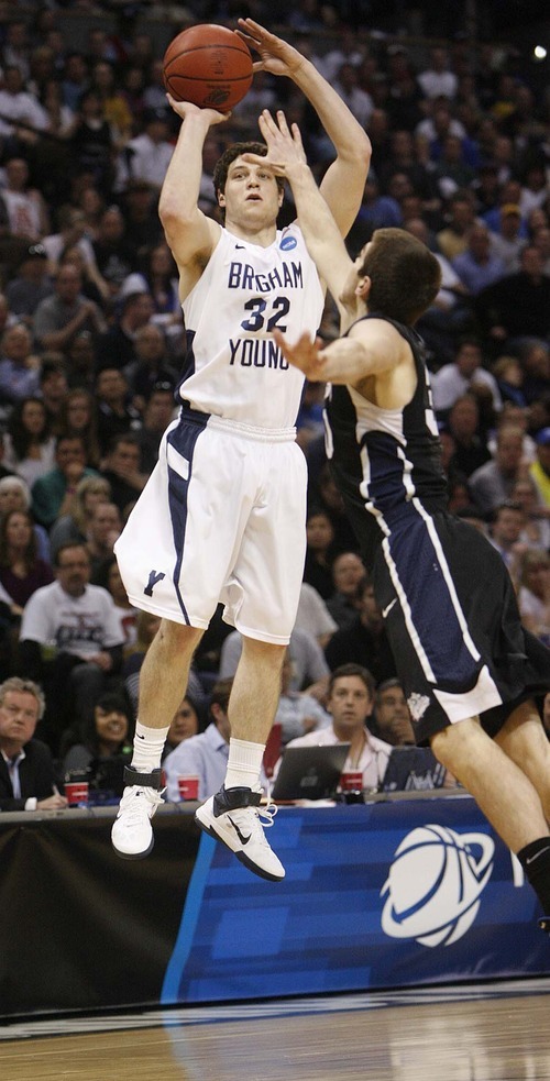 Trent Nelson  |  The Salt Lake Tribune
BYU's Jimmer Fredette shoots over Gonzaga's Mike Hart as BYU faces Gonzaga in the NCAA Tournament, men's college basketball at the Pepsi Center in Denver, Colorado, Saturday, March 19, 2011.