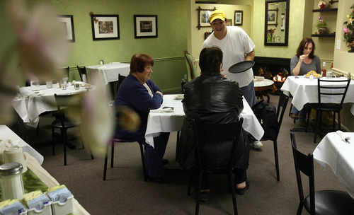 Leah Hogsten  |  The Salt Lake Tribune
Co-owner Candice Pulli serves customers from Lazy Day Cafe in Millcreek.