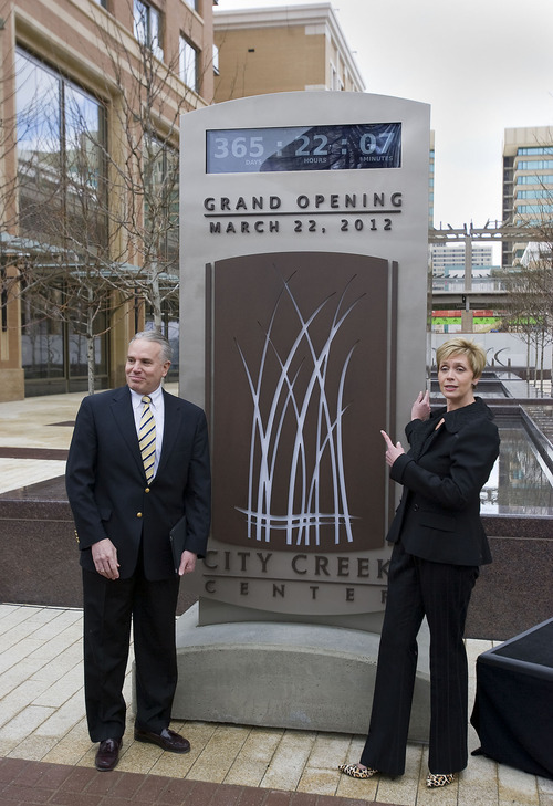 Al Hartmann  |  The Salt Lake Tribune 
Mark Gibbs, president of City Creek Reserve, left, and Linda Wardell, general manager of City Creek Retail Center, unveil a time clock that will count down days, hours and minutes for the next year until City Creek Center opens March 22, 2012. The clock is at 45 W. South Temple.