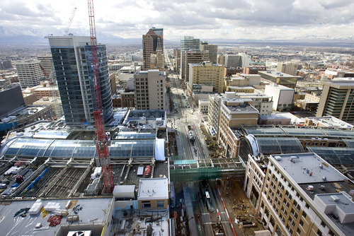 Al Hartmann   |  The Salt Lake Tribune 
View of the City Creek Center looking south down Main Street.  The sky bridge across Main is still under construction.  The retractable roof panels are nearly all in place.