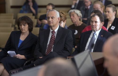 Al Hartmann   |  The Salt Lake Tribune 
Speaker of the House Becky Lockhart, left, Senate President Michael Waddoups and Utah Governor Gary Herbert listen as Lane Beattie, chairman of the GRAMA working group, introduces its members during the group's first meeting Wednesday, March 23.