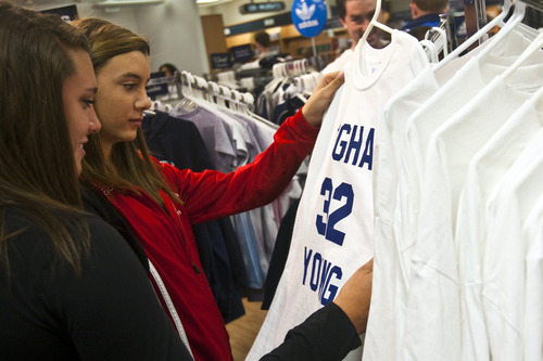 Chris Detrick | The Salt Lake Tribune 
Jessie Wengert and Jordan Wengert, both of Marana, Ariz., look at Jimmer Fredette basketball jerseys for sale at the BYU Bookstore on Wednesday March 23, 2011. In the home of the Cougars, merchandise is flying off shelves.