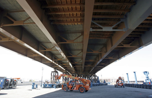 Francisco Kjolseth  |  The Salt Lake Tribune
UDOT gives a media preview Wednesday, March 23, 2011, of the soon-to-be-moved Sam White Bridge over I-15 in American Fork. Measuring 354 feet long, this will be the longest two-span bridge that has ever been moved using Self Propelled Modular Transporters (SPMT) in the Western Hemisphere. The bridge is scheduled to be moved into place in one night on Saturday, March 26.