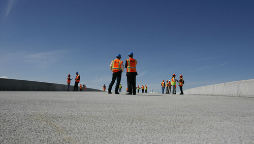 Francisco Kjolseth  |  The Salt Lake Tribune
UDOT gives a media preview Wednesday, March 23, 2011, of the soon-to-be-moved Sam White Bridge over I-15 in American Fork. Measuring 354 feet long, this will be the longest two-span bridge that has ever been moved using Self Propelled Modular Transporters (SPMT) in the Western Hemisphere. The bridge is scheduled to be moved into place in one night on Saturday, March 26.