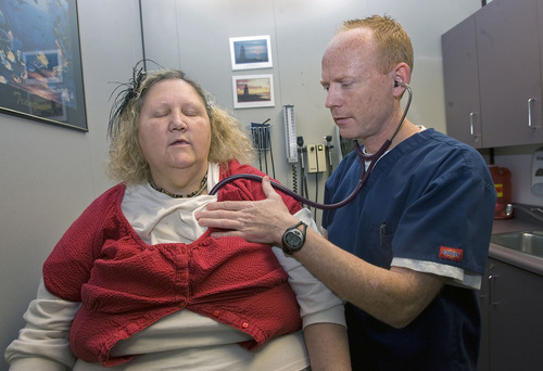 Al Hartmann   |  The Salt Lake Tribune 
Medicaid patient Michelle Huggins gets her heart checked during an exam by nurse practitioner Steven Mickelson at Health Clinic of Utah-Provo at 150 E. Center St. in Provo.  The Utah Legislature voted to close this health clinic, which treats Medicaid patients.
