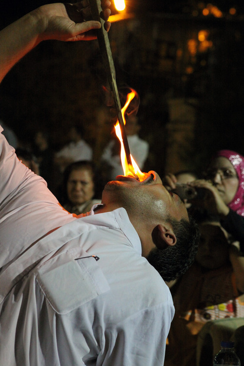Cindy Hosea  |  Special to The Salt Lake Tribune
A Sufi man swallows fire to show his devotion to god during a religious ceremony in September, 2010.