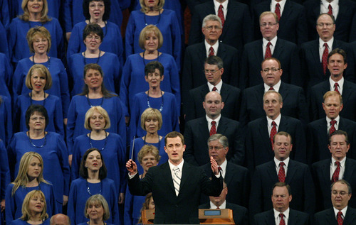 Assistant Music Director Ryan Murphy leads the congregation and the Mormon Tabernacle Choir in the singing of 