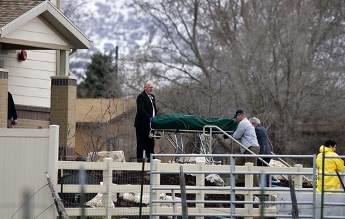 Djamila Grossman  |  The Salt Lake Tribune

Officials carry a body from the Discovery Place, an assisted living facility in Brigham City, on Friday. James Hall, 58, his wife, Kathy Hall, 57, and their son, Erik Hall, 35, died there in a murder-suicide, police said.