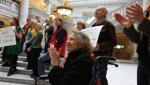 LEAH HOGSTEN  |  The Salt Lake Tribune
Elise Lazar joined about 50 people gathered in the Capitol Rotunda to cheer on the repeal of HB477 on Friday. Lazar says the public has been awakened and won't go back to its previous apathy.