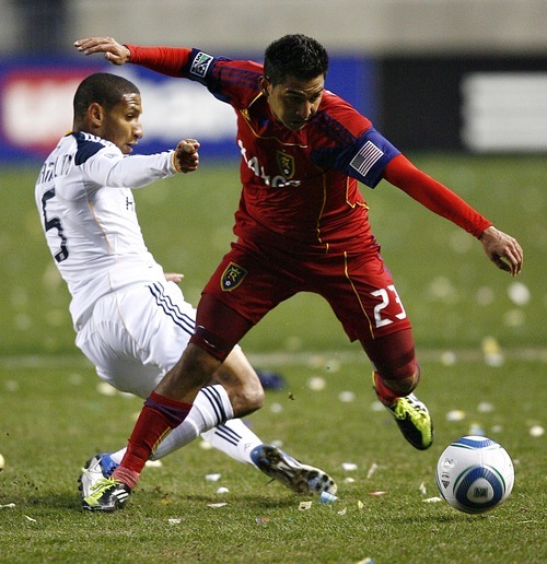 Djamila Grossman  |  The Salt Lake Tribune

Real Salt Lake's Paulo Araujo, Jr., (23) defends the ball against Los Angeles Galaxy's Sean Franklin (5) during the first half of a game at Rio Tinto Stadium in Sandy, Utah, on Saturday,  March 26, 2011. RSL won the game.