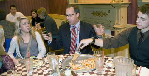 Al Hartmann   |  The Salt Lake Tribune 
Canyons School District superintendent David Doty, center,  talks with Jordan HIgh School students Whitney Combe, left,  and Jayce Anderl, right,  over pizza after taking a large group to the Mark Zuckerberg speech at BYU on Friday, March 25.    He tweets and  frequently attends events with  students from the district.