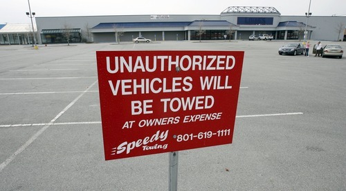 Steve Griffin  |  The Salt Lake Tribune
 A sign warns people that they will be towed if they park in the parking lot at the old Lowes at 203 W. 9000 South in Sandy. There have been 2,600 vehicles towed there since September 2008.