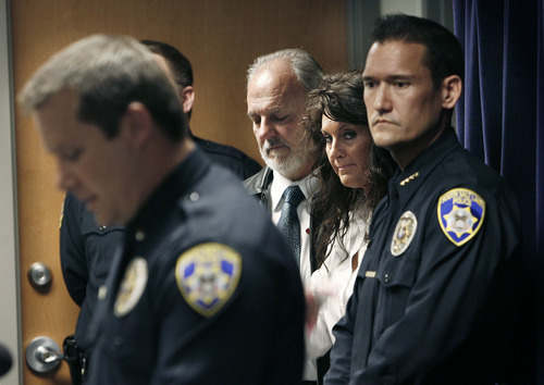 Scott Sommerdorf  |  The Salt Lake Tribune
As South Salt Lake police lead investigator Dwyane Ruth speaks at left, Earl Black, husband of the victim Sherry Black, holds his daughter, Heidi Miller during a joint news conference with the Friends of Sherry Black organization to announce the latest developments in the Sherry Black homicide investigation, Monday, March 28, 2011. A $50,000 reward for information leading to the arrest and successful prosecution of the murderer was announced. South Salt Lake Police Cheif Chris Snyder is at far right.
