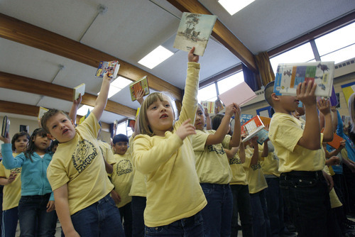 Francisco Kjolseth  |  The Salt Lake Tribune
First graders at Taylorsville Elementary Aaron Gull, 7, left, and Ashley Lee Jensen, 7, center sing 