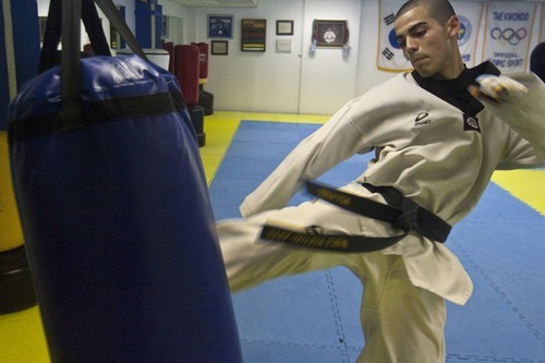 Chris Detrick | The Salt Lake Tribune 
Andres Pizarro works out at Pace Academy Tae Kwon Do on Thursday. Pizarro, a senior at Juan Diego Catholic High School, is a multiple Tae Kwon Do champion.