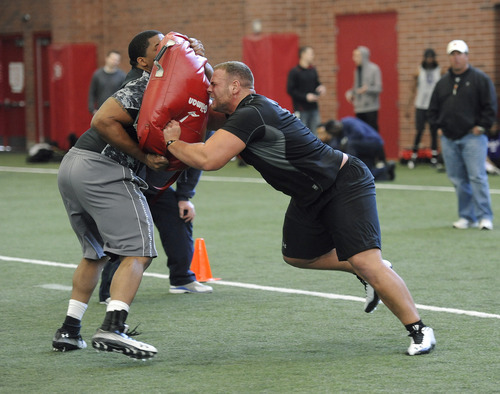 Sarah A. Miller  |  The Salt Lake Tribune

University of Utah offensive linemen Zane Taylor, left, and Walter Watts, right, perform drills for NFL scouts at Pro Day on Tuesday, March 29, 2011, at the University of Utah's Spence Eccles Field House in Salt Lake City.