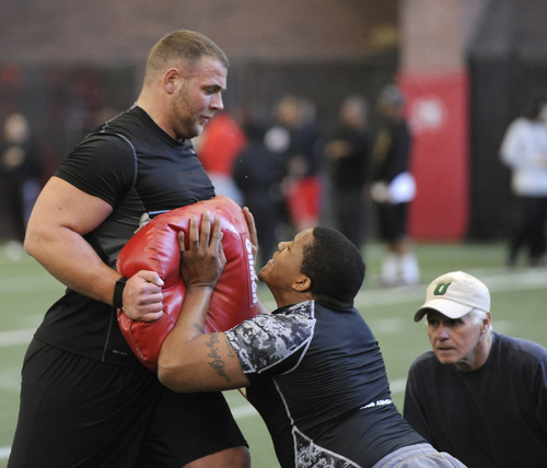 Sarah A. Miller  |  The Salt Lake Tribune

University of Utah offensive linemen Zane Taylor, left, and Walter Watts, right, perform drills for NFL scouts at Pro Day on Tuesday, March 29, 2011, at the University of Utah's Spence Eccles Field House in Salt Lake City.