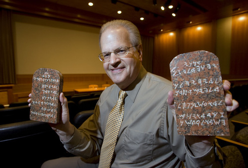 Al Hartmann   |  The Salt Lake Tribune 
 James D'Arc, archivist for BYU's special collections, holds two rare red granite tablets hewn from Mount Sinai, which were promotional pieces given to VIPs and religious leaders for 
