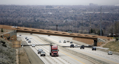 Francisco Kjolseth  |  The Salt Lake Tribune
Traffic moves along I-215 under the 4500 South bridge in Salt Lake City on Wednesday, March 30, 2011. Utah's highway bridges now rank among the safest in the nation, but still have room for improvement, says a new national report. The new safety status is in large part due to the recent highway improvements along the I-15, I-80 and the I-215 corridors.