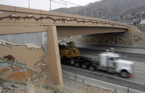 Francisco Kjolseth  |  The Salt Lake Tribune
Traffic moves along I-215 under the 3300 South bridge in Salt Lake on Wednesday, March 30, 2011. Utah's highway bridges now rank among the safest in the nation, but still have room for improvement, says a new national report. The new safety status is in large part due to the recent highway improvements along the I-15, I-80 and the I-215 corridors.