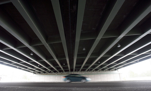 Francisco Kjolseth  |  The Salt Lake Tribune
Traffic moves along 700 East in Salt Lake under the I-80 bridge on Wednesday, March 30, 2011. Utah's highway bridges now rank among the safest in the nation, but still have room for improvement, says a new national report. The new safety status is in large part due to the recent highway improvements along the I-15, I-80 and the I-215 corridors.