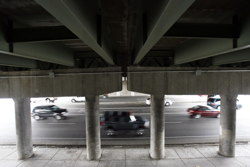 Francisco Kjolseth  |  The Salt Lake Tribune
Traffic moves along State street in Salt Lake City under one of the new bridges along the I-80 corridor on Wednesday, March 30, 2011. Utah's highway bridges now rank among the safest in the nation, but still have room for improvement, says a new national report. The new safety status is in large part due to the recent highway improvements along the I-15, I-80 and the I-215 corridors.