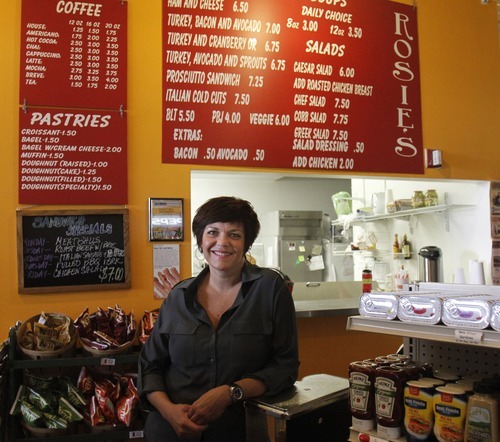 Rick Egan   |  The Salt Lake Tribune

Owner Amber Radman serves sandwiches at Rosie's Deli, which is  inside the Jade Market on 200 South in Salt Lake City.
