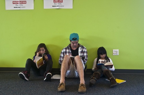 Chris Detrick | The Salt Lake Tribune 
Michelle Salazar, 9, Sean Johnson, and Nathalie Rossi, 8, read books at the YMCA Community Family Center in Taylorsville on Wednesday, March 23, 2011.